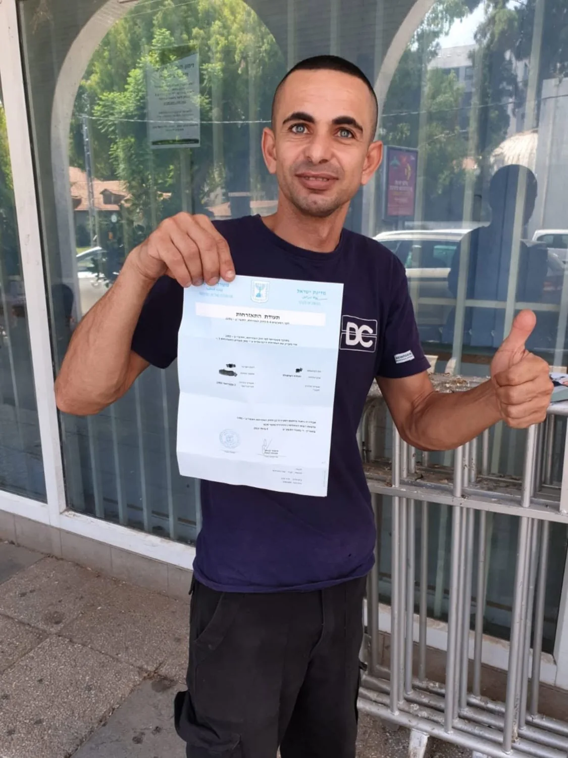 M. with his naturalisation certificate; the original redactions have been retained.